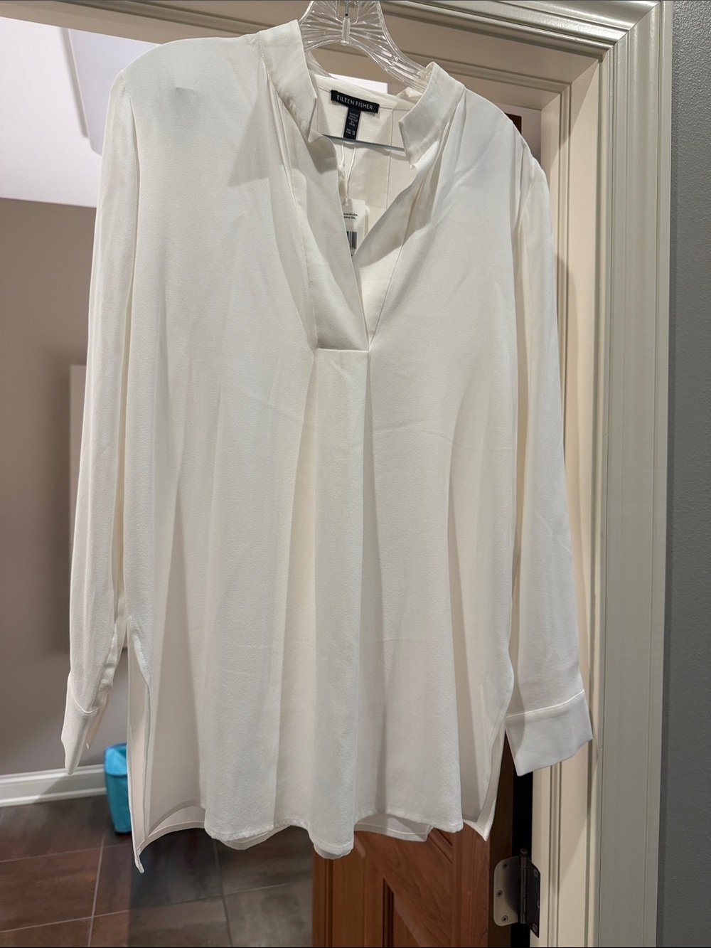 White/cream colored Eileen Fisher crêpe stand collar tunic.